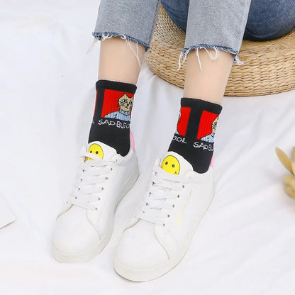 Stylish Hip Hop Long Socks for Women & Girls designed with an artistic cartoon theme, showcasing a fun black and red pattern, perfect for casual and chic outfits.