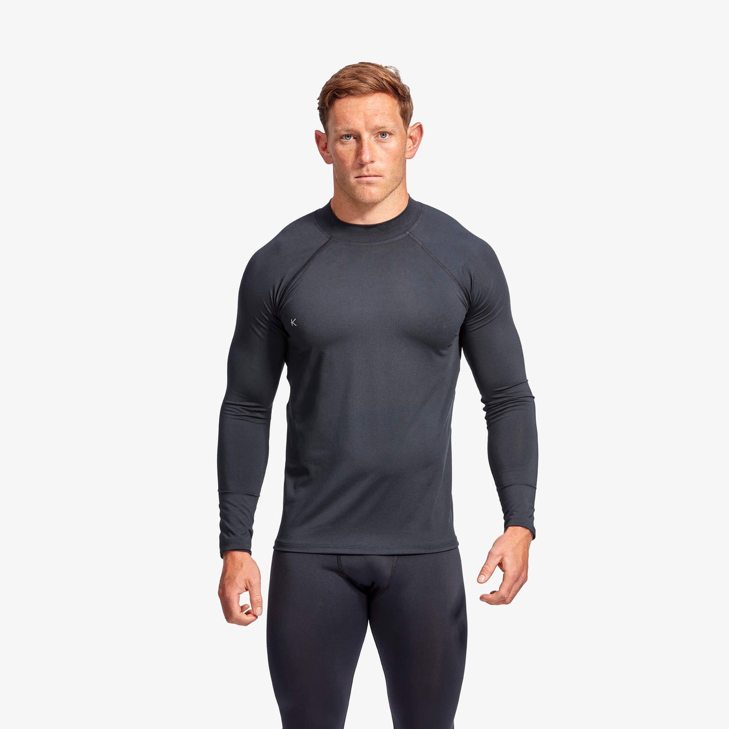 Model wearing KYMIRA Men's Long Sleeve Infrared Recovery Baselayer, demonstrating the perfect fit and style for optimal performance and recovery in sports.