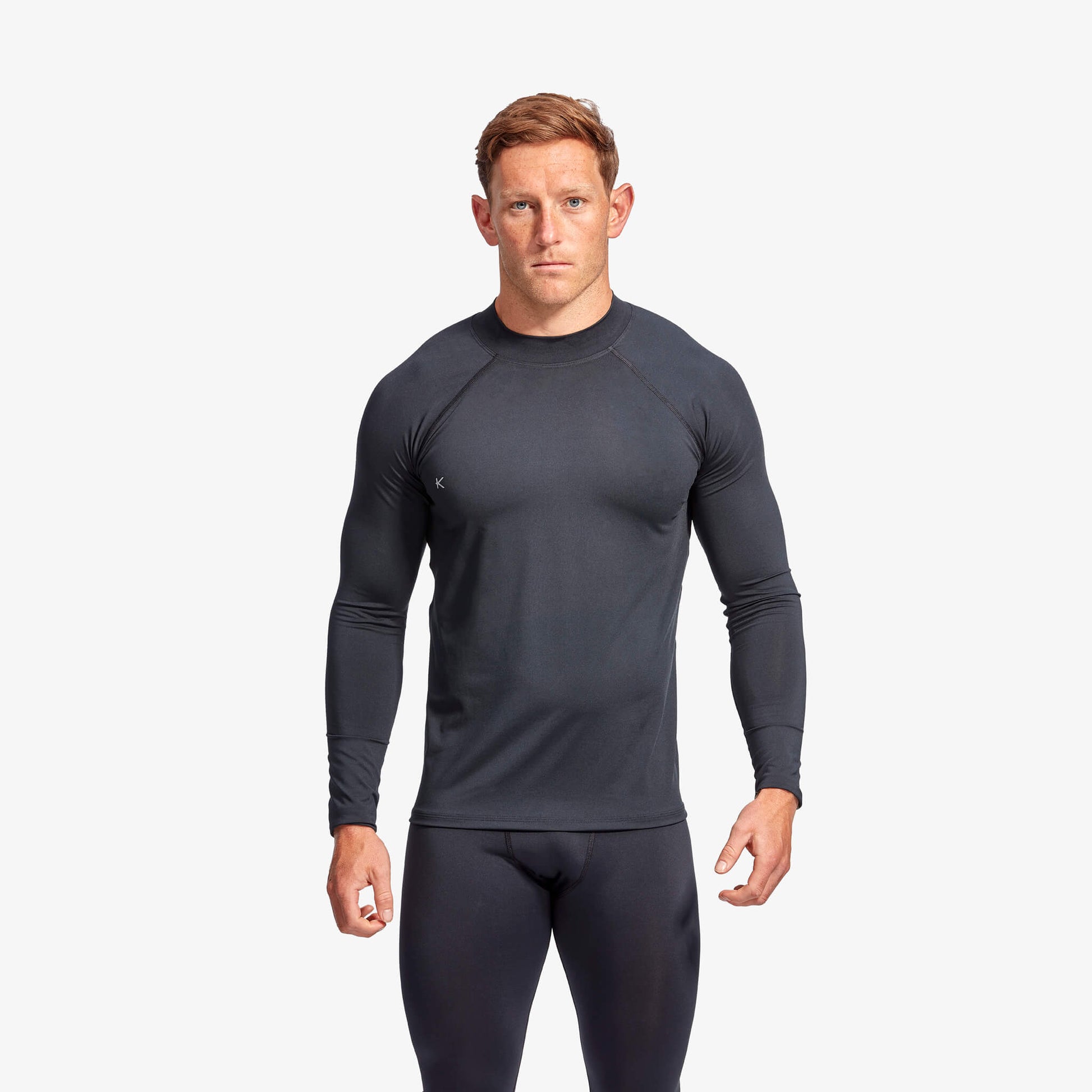 Model wearing KYMIRA Men's Long Sleeve Infrared Recovery Baselayer, demonstrating the perfect fit and style for optimal performance and recovery in sports.