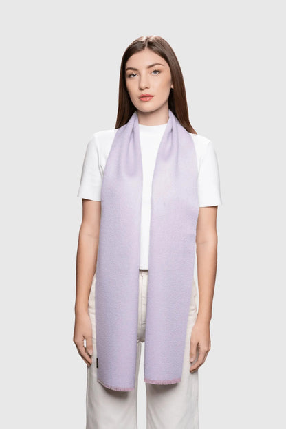 Elegant lifestyle shot of a model wearing the luxurious two tone baby alpaca scarf, embodying sophisticated winter fashion.