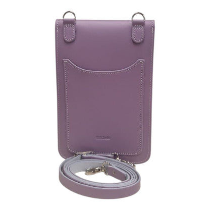 Stylish model wearing the Zatchels Luxury Handmade Leather Mobile Phone Pouch with an adjustable strap, demonstrating its elegant versatility for day or night outings.