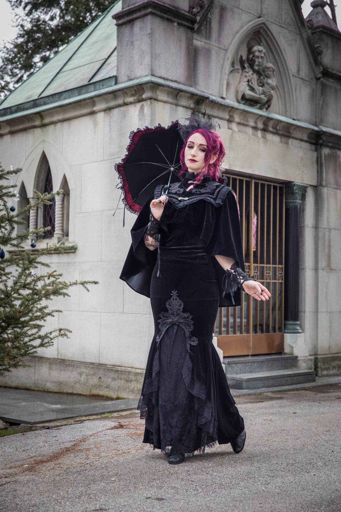 Close-up detail of the embroidery and lace neckline on the Dark In Love velvet Lark capelet, illustrating the exceptional craftsmanship and luxury appeal.