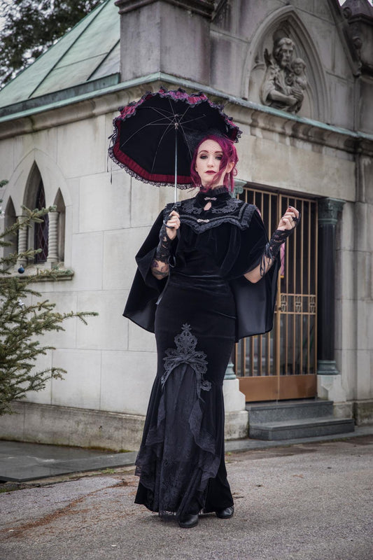 Close-up view of Dark In Love's Lark Capelet showcasing ornate clasp fastenings and luxurious velvet fabric, ideal for adding sophistication to any outfit.