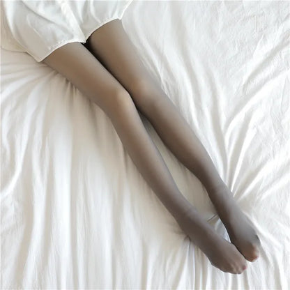 Stylish display of gray Elegant Women's Insulated Translucent Fleece Tights lying elegantly on white linen, emphasising warmth and fashion for every occasion.