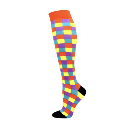 Women's Knee Length Compression Travel Socks for Comfort, Style, and Circulation showcasing a colourful checkered pattern in bright hues, ideal for stylish trips.