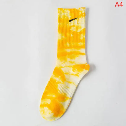 Luxurious Women's Tie-Dye Middle Tube Socks featuring a bright yellow and white tie-dye design, embodying vibrant comfort and style for any occasion.