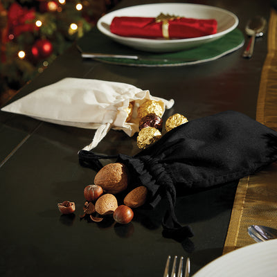 Luxury Organic Cotton Drawcord Bag displayed in a refined setting, highlighting its versatility and eco-conscious design.