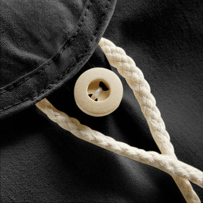 Premium organic cotton backpack with a vibrant design, perfect for festivals and casual use, emphasising sustainability.