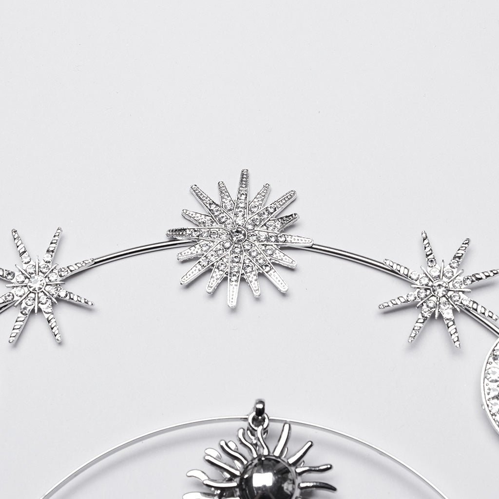 Elegant Punk Rave Estrella Tiara showcasing intricate sun, moon, and star charms, crafted from luxurious stainless steel.