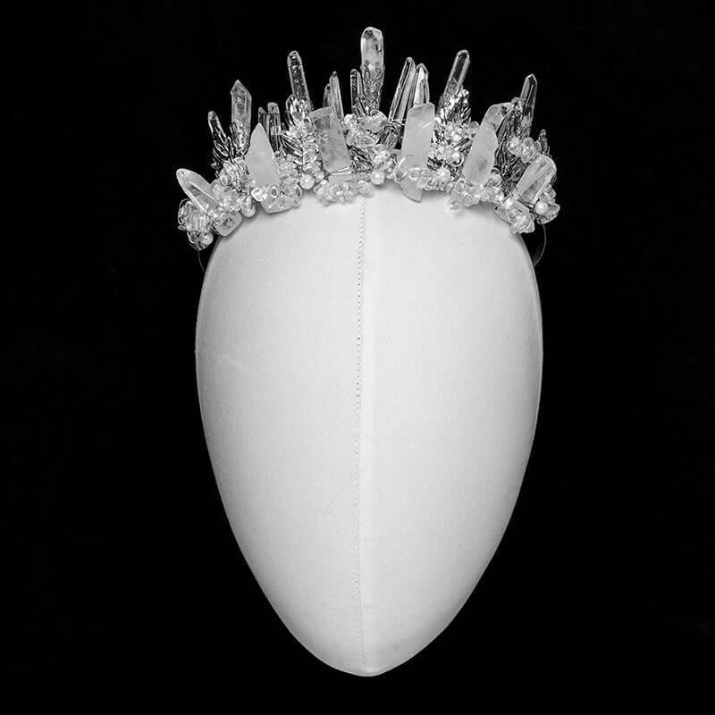 Stylish display of Punk Rave white crystal headband among other luxurious accessories, embodying breathtaking glamour.