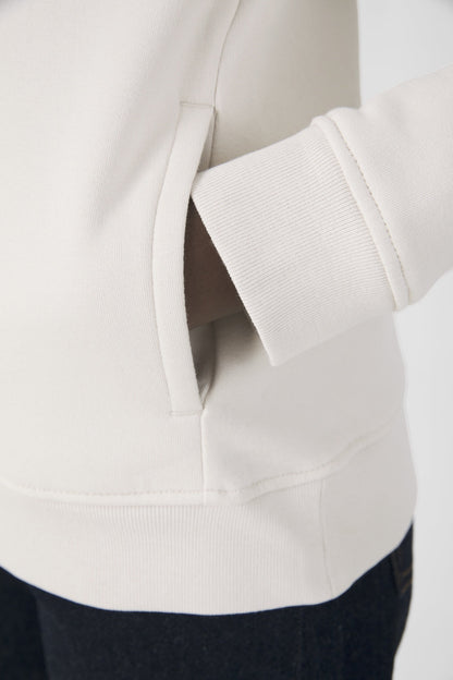 Elegant women's organic essential hoodie in soft grey, featuring 80% organic cotton for ultimate comfort and style.