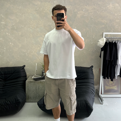 Elegant heavyweight white blank tee from FROST, featuring an oversized boxy fit and dropped shoulders for ultimate comfort.