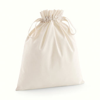 Multiple sizes of luxury organic cotton drawcord bags displayed together, emphasizing eco-friendly chic.