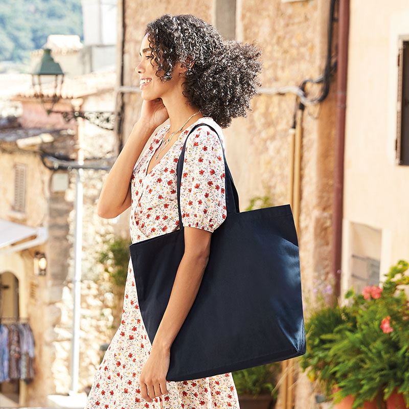 Luxury Organic Cotton Maxi Tote in eco-friendly design, showcasing its lightweight structure and spacious capacity, perfect for stylish shopping.