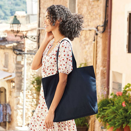 Luxury Organic Cotton Maxi Tote in eco-friendly design, showcasing its lightweight structure and spacious capacity, perfect for stylish shopping.