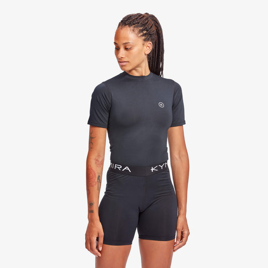 Close-up view of KYMIRA IR50 Infrared Performance Baselayer Top showcasing its breathable, quick-drying fabric and tailored fit for women's athletic wear.