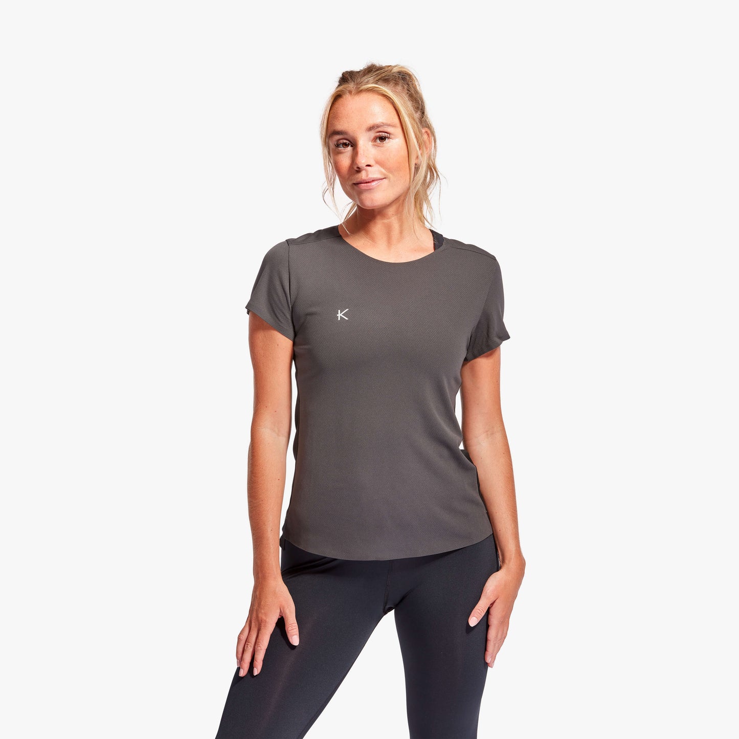KYMIRA Women's Infrared Performance T-Shirt showcasing pleated back detail, designed for ultimate flexibility and breathability.