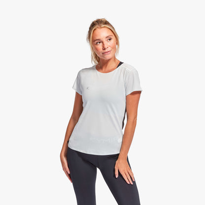 KYMIRA Women's infrared performance t-shirt modelled outdoors, representing elegance and functionality in activewear.