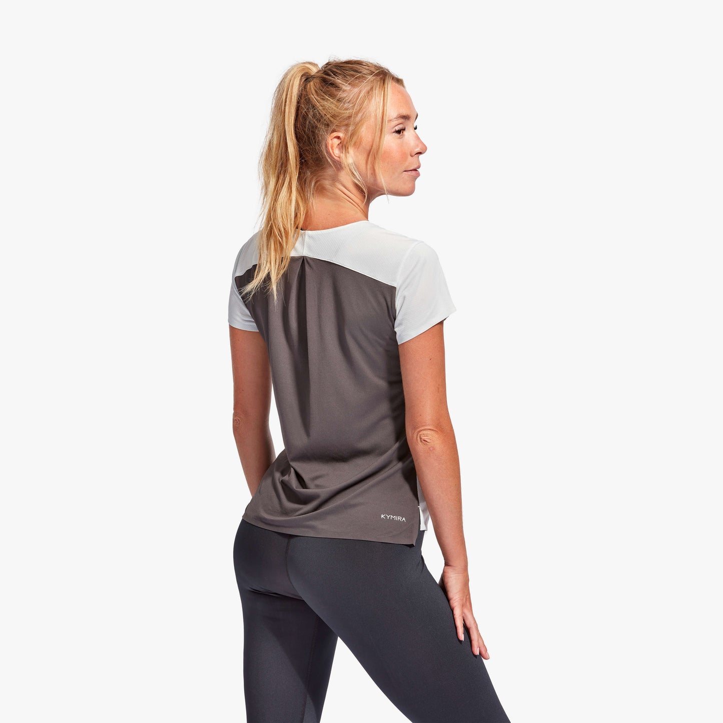 Luxurious KYMIRA Women's Infrared Performance T-Shirt showcasing pleated back design for enhanced flexibility, perfect for high-intensity workouts.