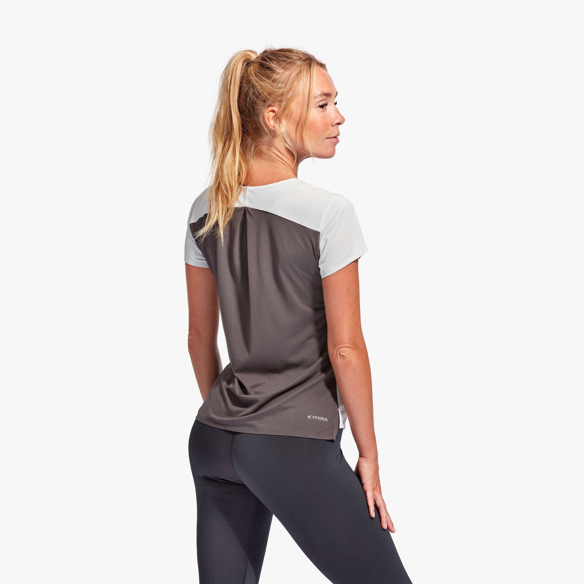 Luxurious KYMIRA Women's Infrared Performance T-Shirt showcasing pleated back design for enhanced flexibility, perfect for high-intensity workouts.