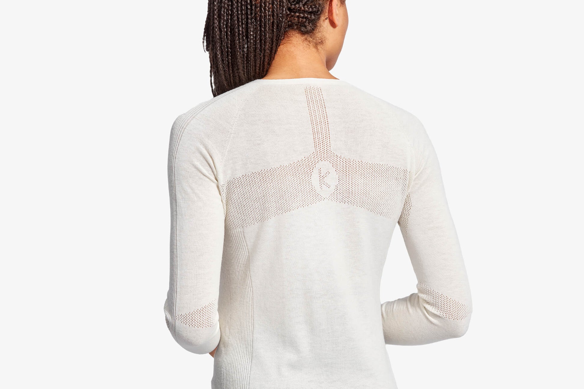 Model demonstrating the Women's KYMIRA Infrared Merino Ecoknit Baselayer Top LS, highlighting its flattering fit and stylish design, ideal for discerning athletes.