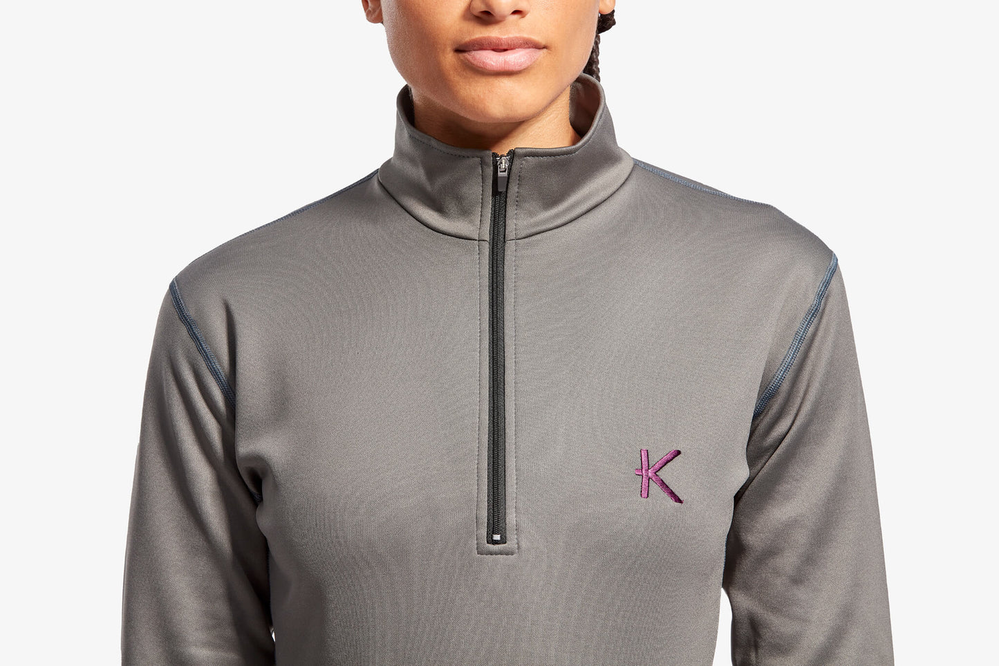 Close-up of luxurious half zip fleece collar by KYMIRA, featuring exceptional warmth and stylish fit for women's activewear.