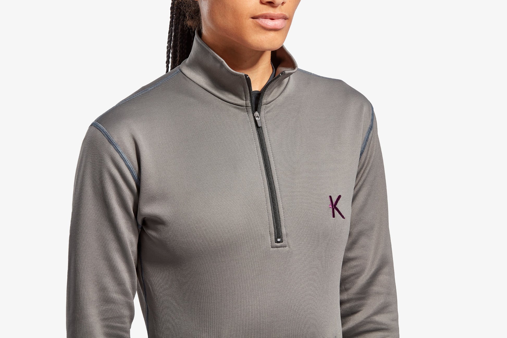 Model wearing KYMIRA's luxury infrared fleece, demonstrating the sleek active fit perfect for outdoor activities and casual wear.