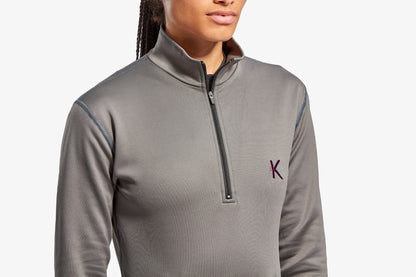 Model wearing KYMIRA's luxury infrared fleece, demonstrating the sleek active fit perfect for outdoor activities and casual wear.