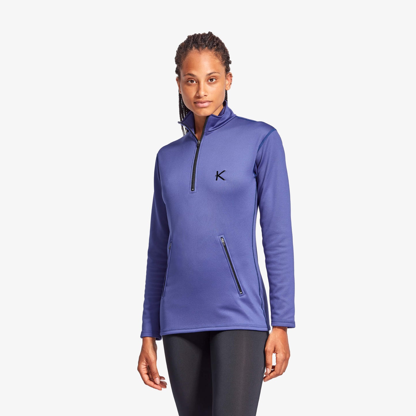 KYMIRA women's infrared half zip fleece in a serene outdoor setting, highlighting its blend of luxury, performance, and recovery benefits.