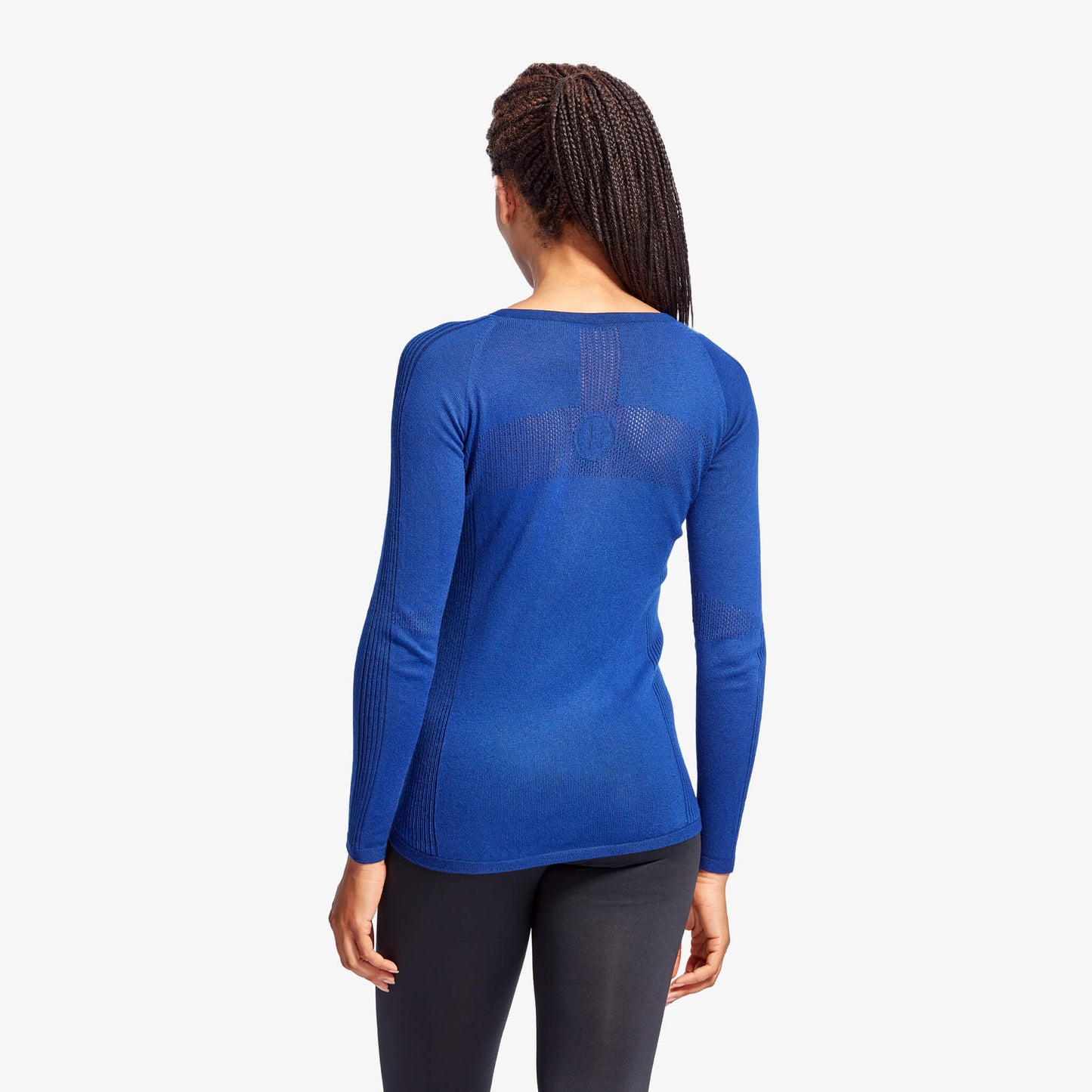 Close-up view of KYMIRA's Women's Merino Wool Baselayer featuring expandable side panels for a perfect fit and modern style.