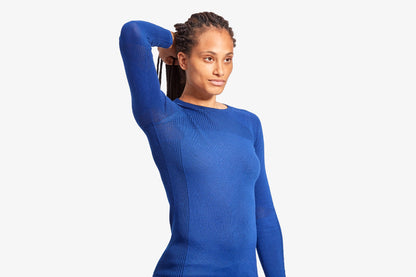 The luxurious KYMIRA Women's Merino Wool Baselayer Top displayed with a focus on its flattering ribbed neckline for a sophisticated look.