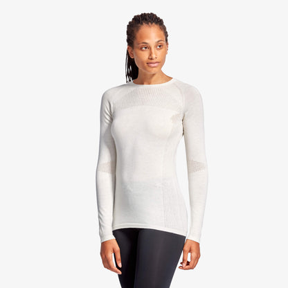 KYMIRA Women's Baselayer Top crafted from sustainably sourced merino wool, highlighting the functional design for both performance and recovery.