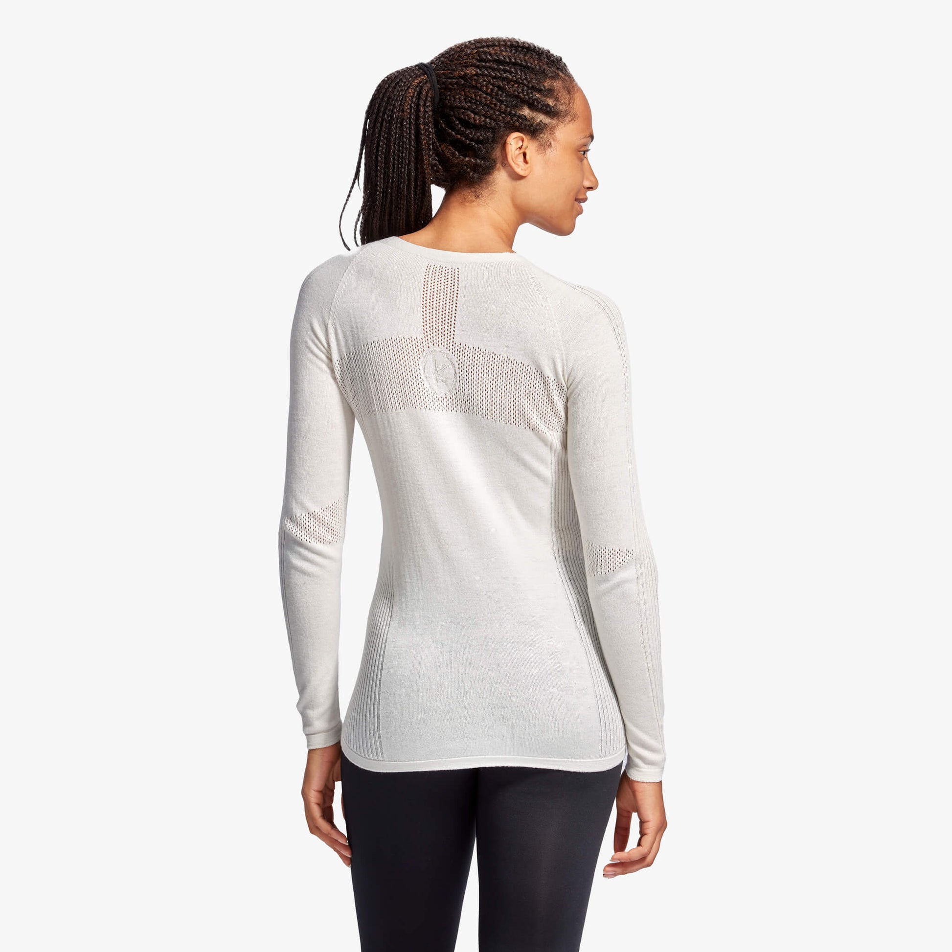 Elegant luxury women's infrared merino wool baselayer top by KYMIRA, featuring cooling zones for optimal temperature regulation.