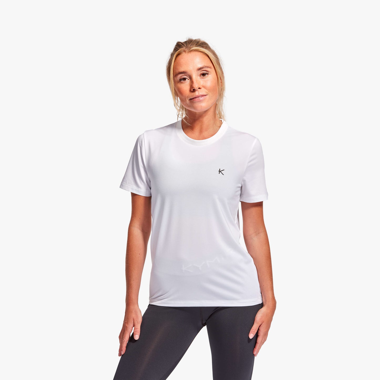 KYMIRA Luxury Women's T-Shirt in bold hues, illustrating the innovative Kynergy fabric that enhances recovery performance.