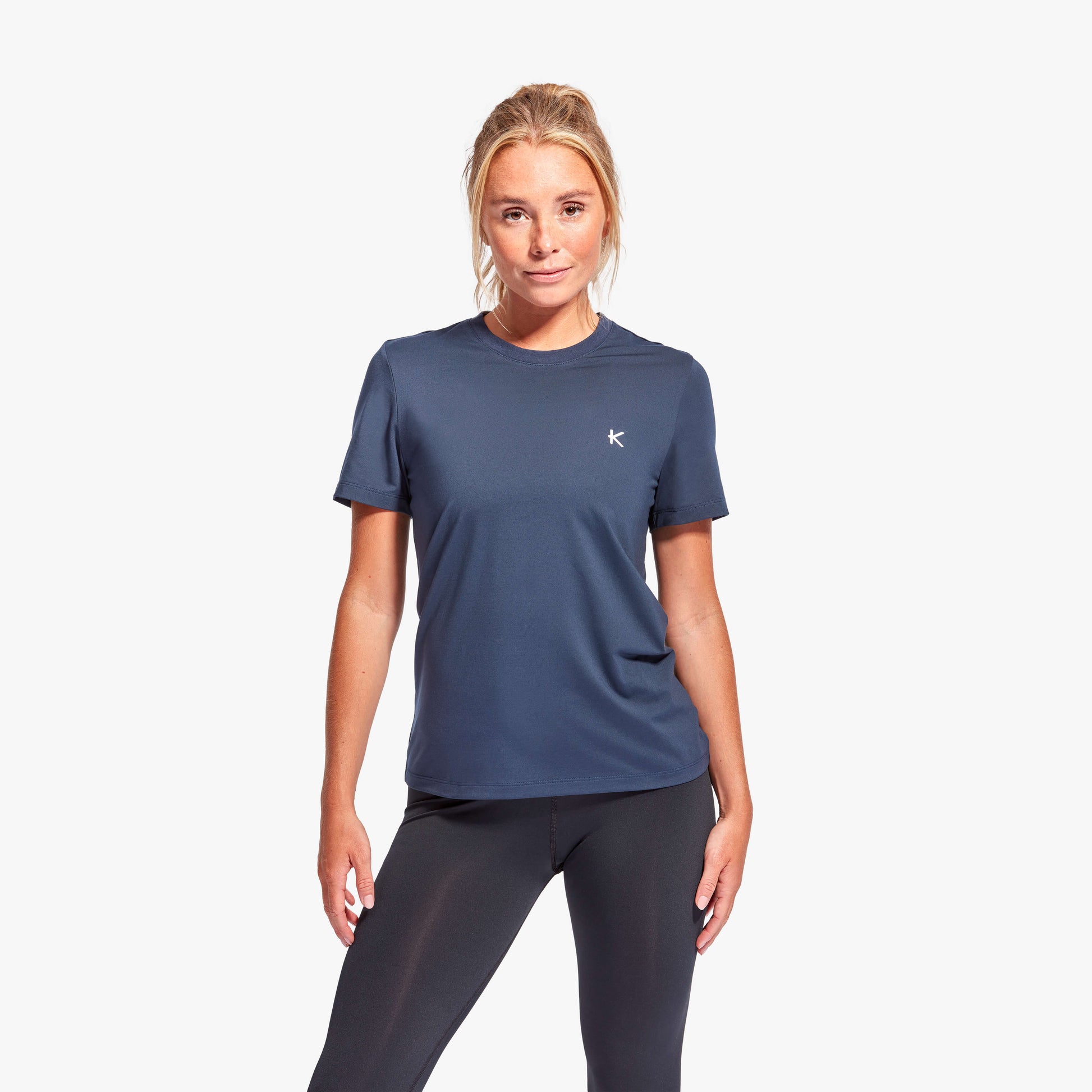 Women modelling the KyMIRA Luxury Infrared Recovery T-Shirt, highlighting the loose fit and bold design for stylish comfort.