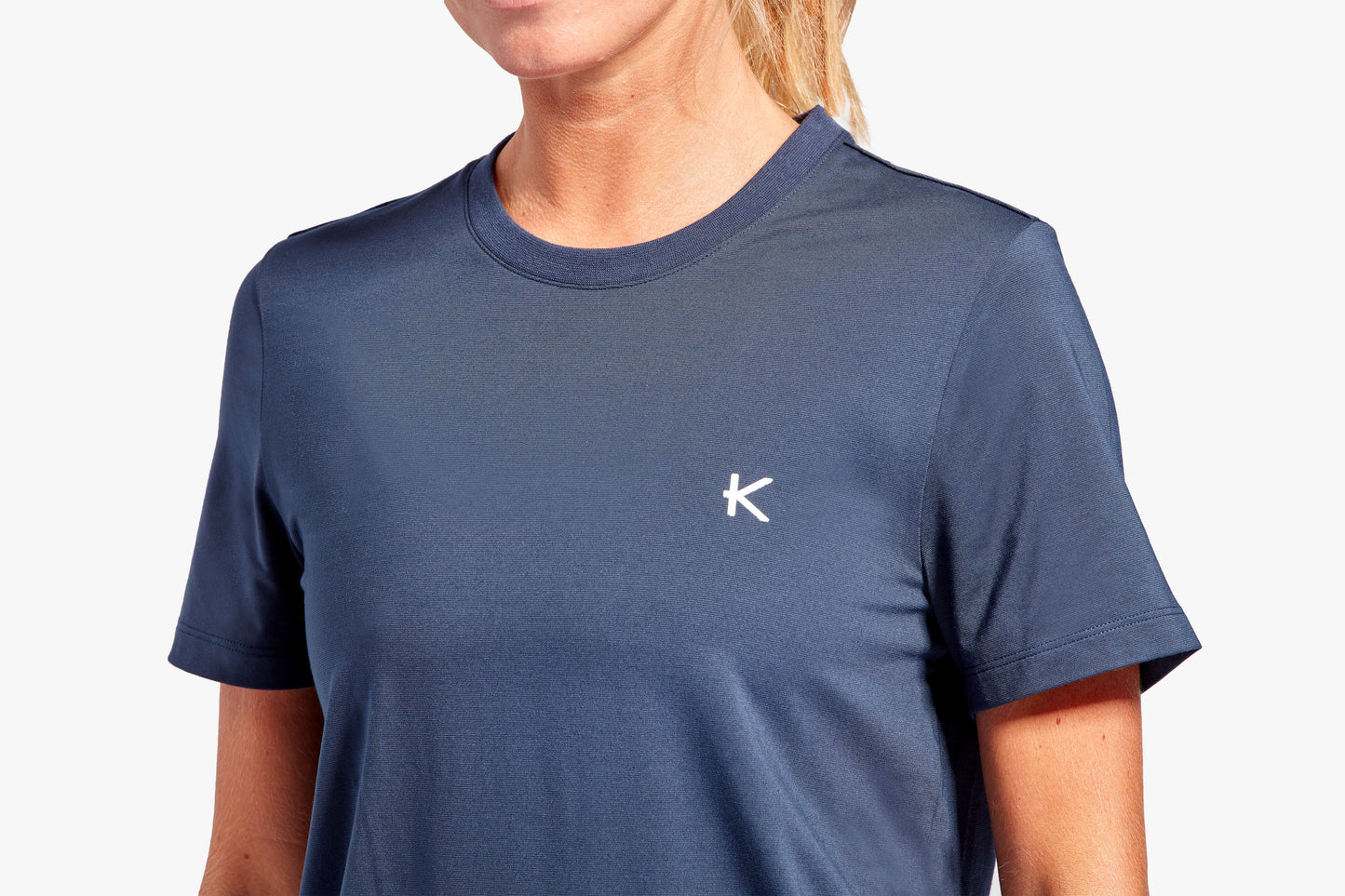 Fashionable display of the KyMIRA Women's Recovery T-Shirt in an activewear setting, illustrating its perfect blend of style and functionality.