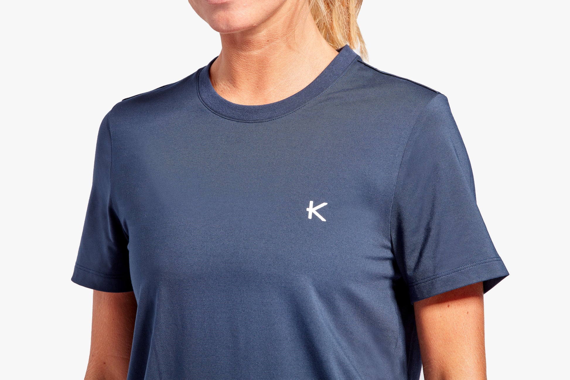 Fashionable display of the KyMIRA Women's Recovery T-Shirt in an activewear setting, illustrating its perfect blend of style and functionality.