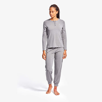 Model wearing KYMIRA Women's Infrared Recovery Henley Sleepwear Top, highlighting its stylish long sleeve design and elegant fit for a restful night.