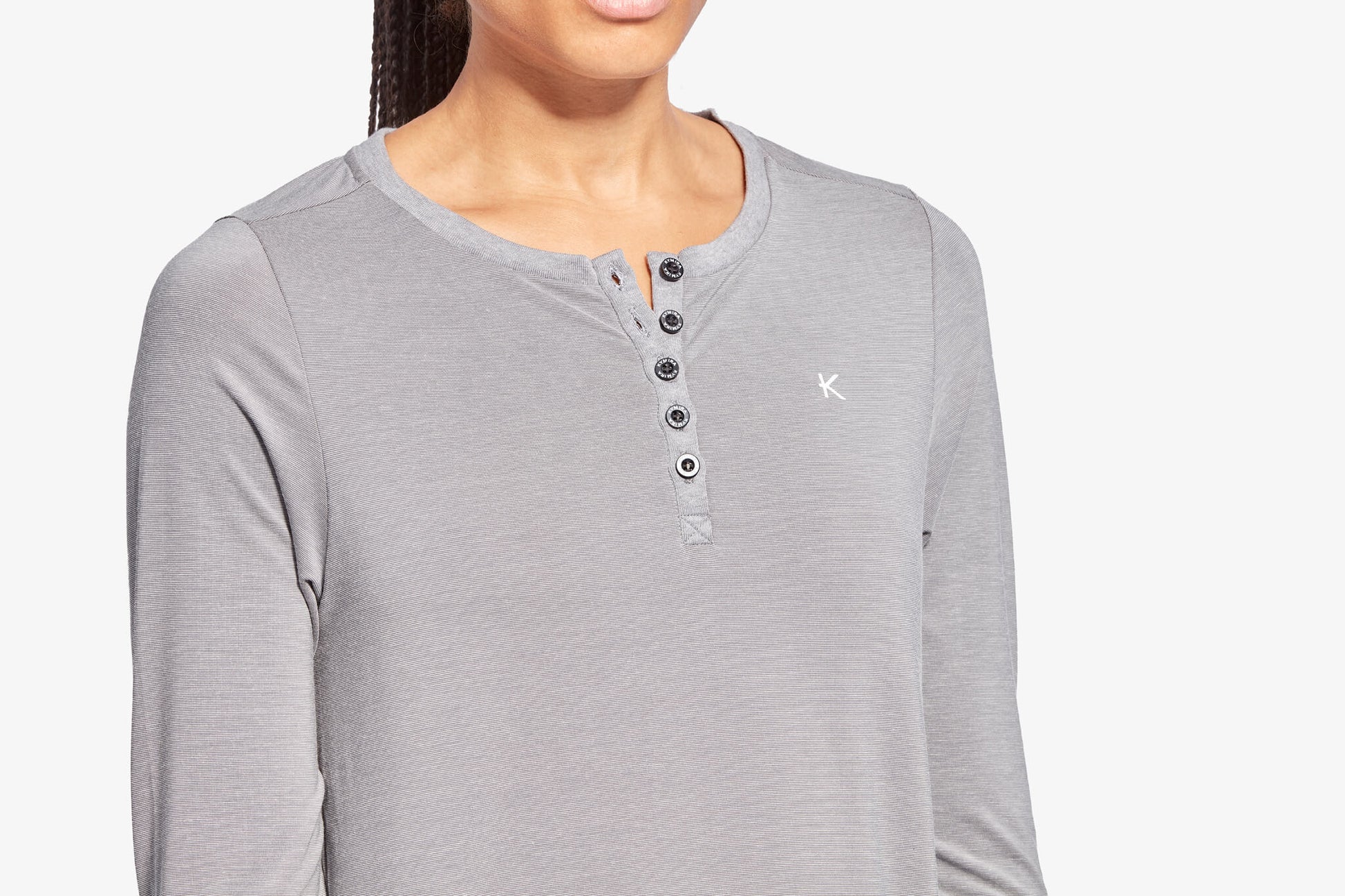 KYMIRA Women's Infrared Recovery Henley Sleepwear Top displayed with fabric details; blends Tencel™ and Celliant® for enhanced sleep quality and recovery benefits.