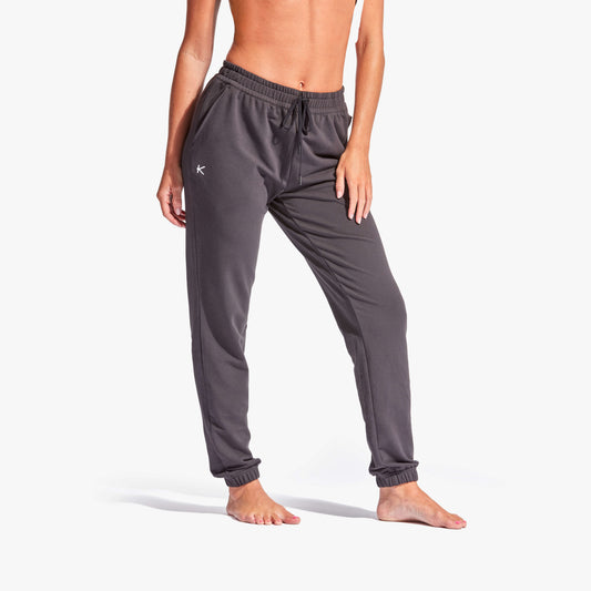 Luxury women's infrared recovery tracksuit bottoms by KYMIRA, featuring a relaxed fit and Kynergy technology for enhanced post-exercise recovery.