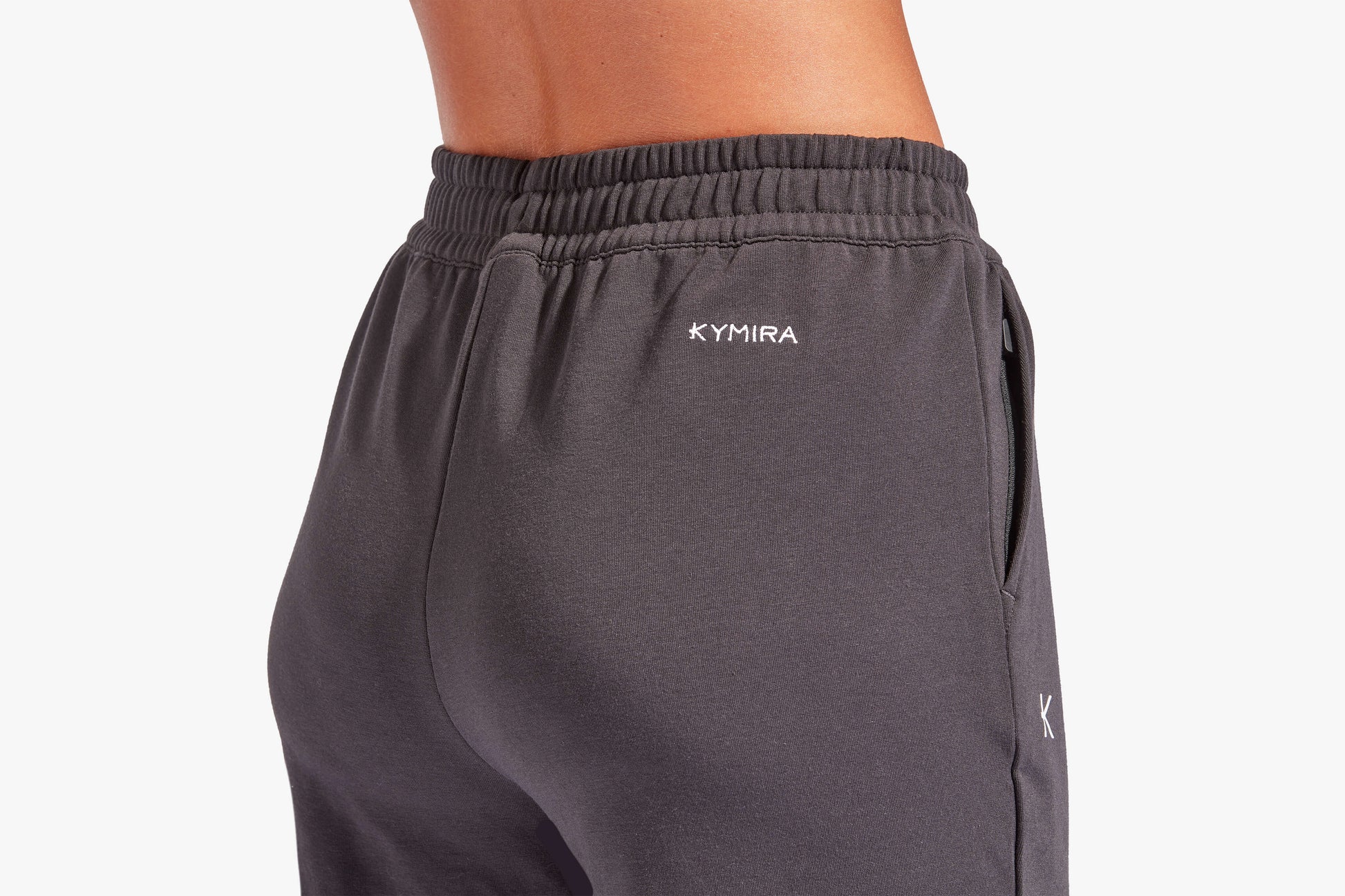 Luxury women's infrared recovery tracksuit bottoms by KYMIRA featuring a loose fit, elasticated waist, and cuffed ankles for ultimate comfort and relaxation.
