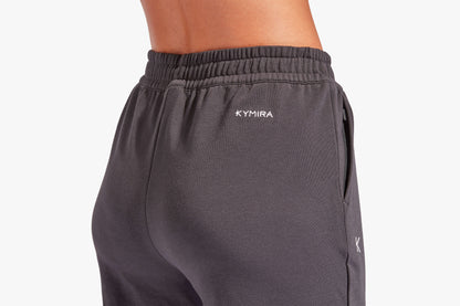 Luxury women's infrared recovery tracksuit bottoms by KYMIRA featuring a loose fit, elasticated waist, and cuffed ankles for ultimate comfort and relaxation.