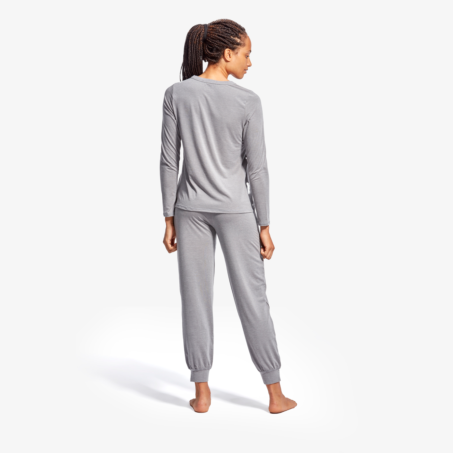 Model in KYMIRA Women's Infrared Recovery Henley Sleepwear Top, highlighting the breathable fabric and elegant fit, ideal for luxurious sleep.