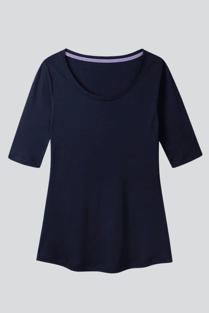 Chic women's half sleeve scoop neck t-shirt displayed on a model, demonstrating effortless style for casual outings and workdays.