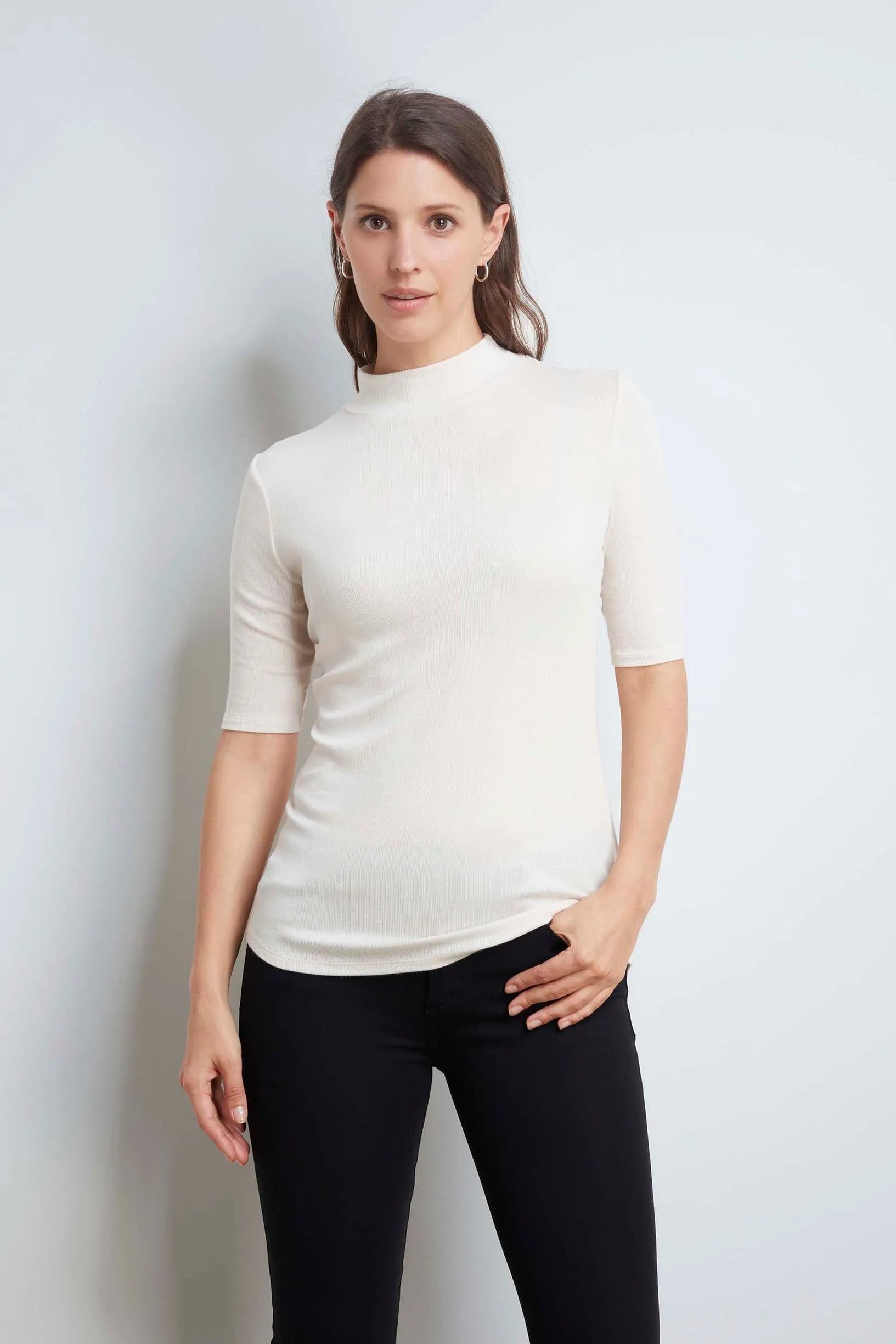Close-up of the women's Mock Neck Micro Modal Top, highlighting its premium TENCEL™ Modal fabric and sophisticated ribbed texture.
