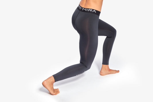 Close-up of KYMIRA women's fitted performance leggings showcasing flatlock stitching and breathable fabric, perfect for elite athletic comfort.
