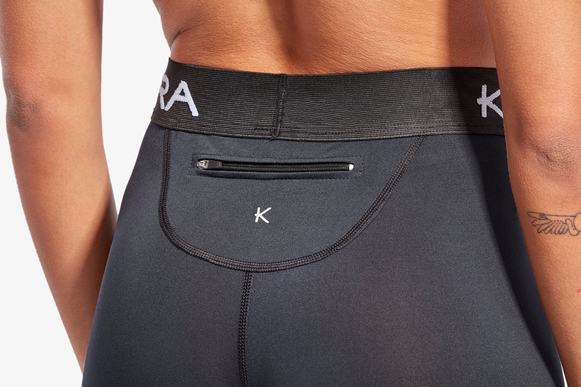 Side view of Women's KYMIRA Infrared Performance Leggings, highlighting the elasticated waistband and compressive calf fit for enhanced support during workouts.