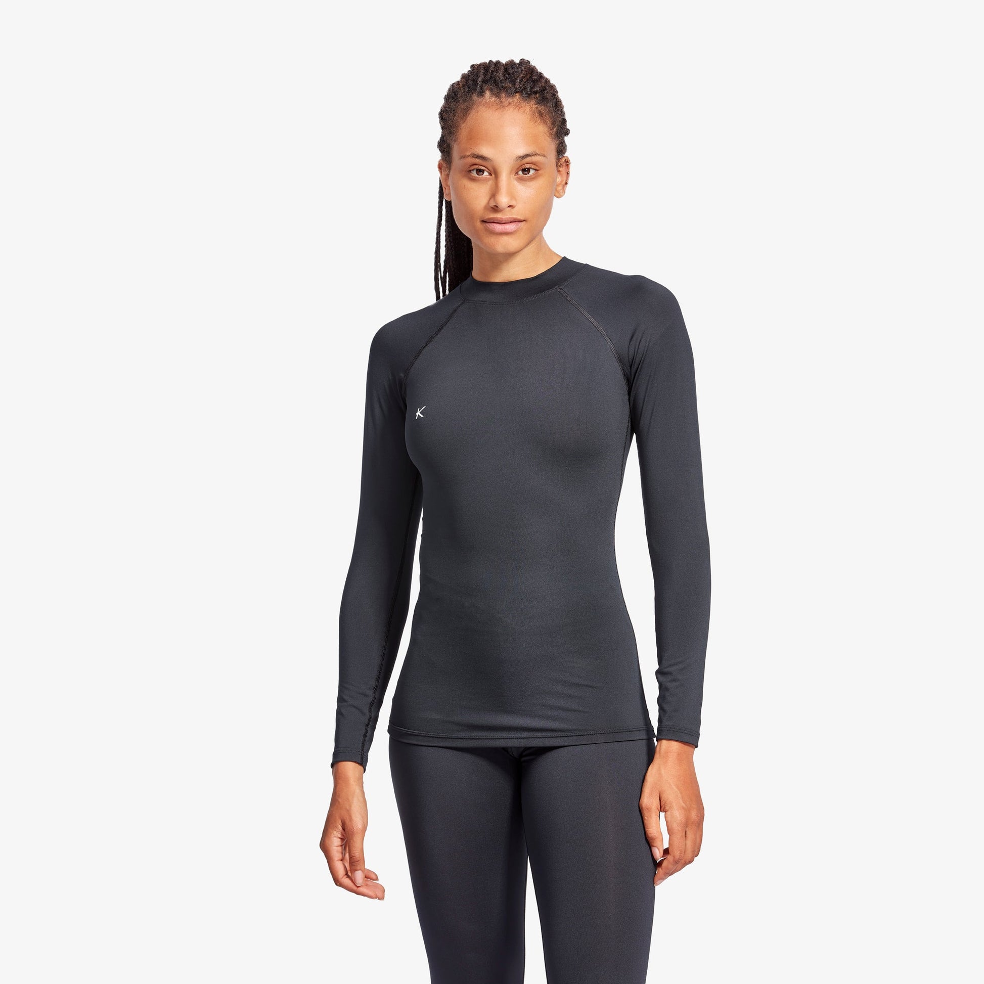Women's Luxury Infrared Recovery Baselayer Top by KYMIRA features quick-dry technology and an ergonomic fit, showcasing its structured shoulder design suitable for athletic performance.