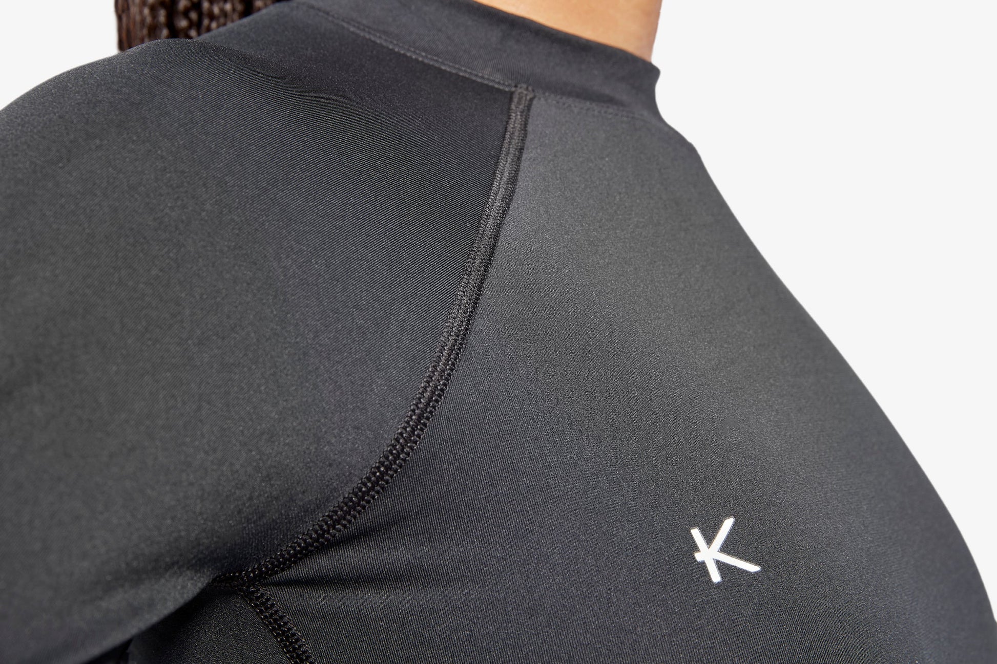 Women's Luxury Infrared Recovery Baselayer Top by KYMIRA showcasing its ergonomic fit and quick-dry fabric, designed for optimal performance and comfort during workouts.