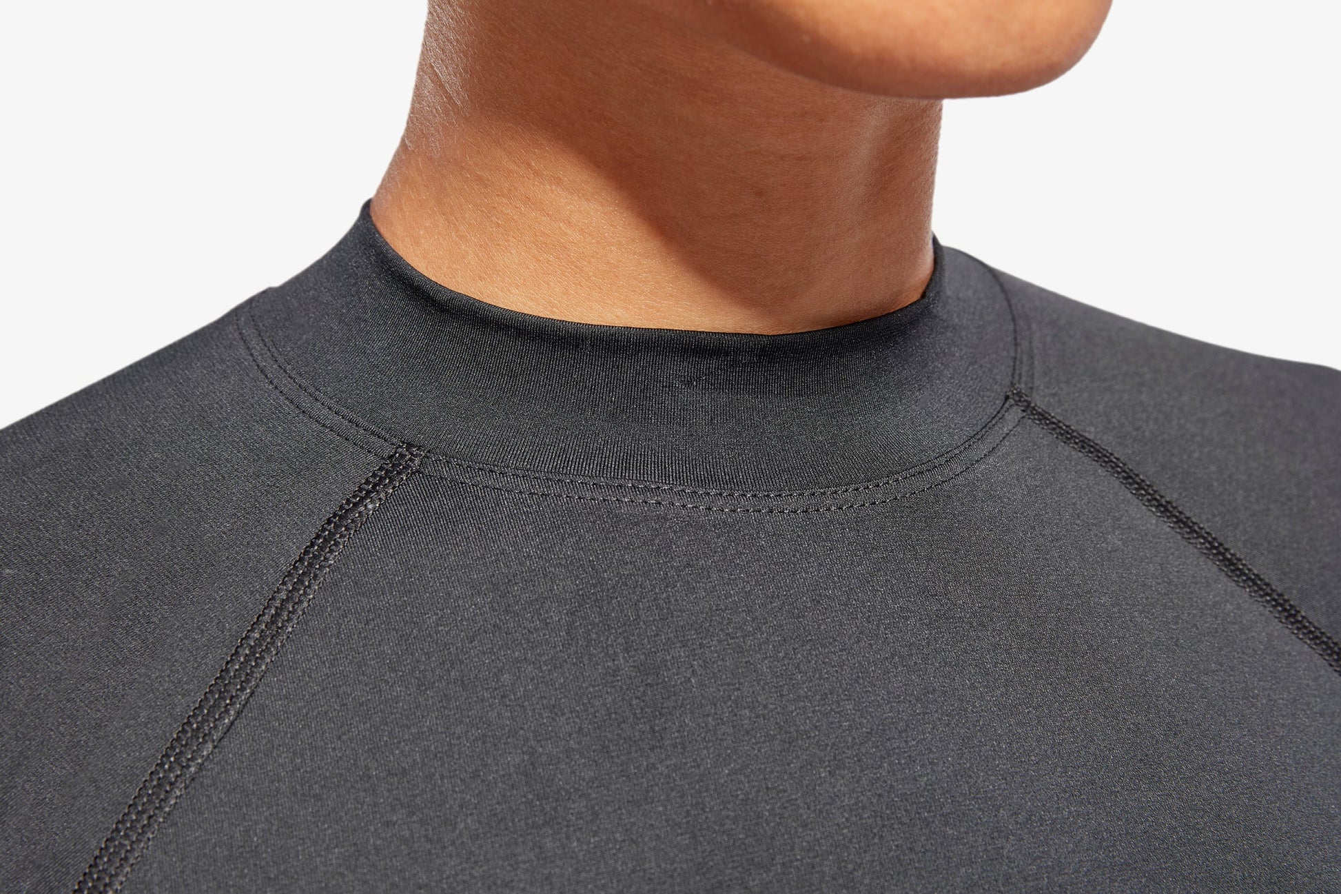 Close-up of KYMIRA's Women's Luxury Infrared Recovery Baselayer Top, highlighting its breathable fabric and durable construction, ideal for providing exceptional comfort during workouts.